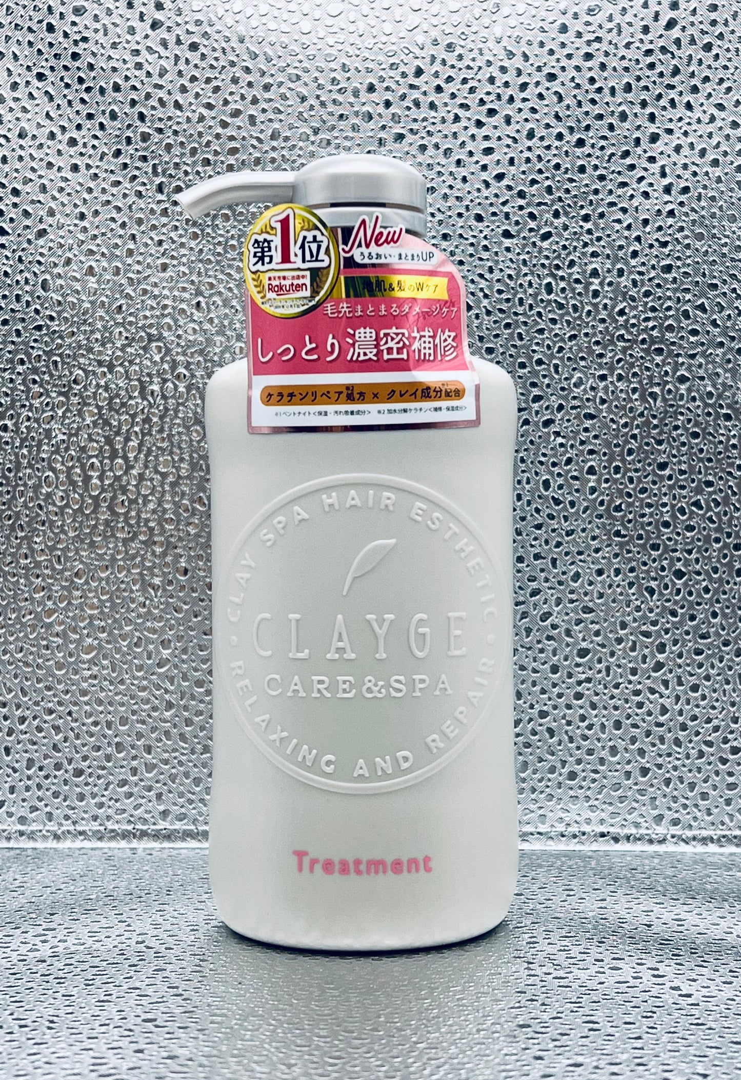 Clayge Treatment DN Anti-Frizz Intensive Repair Hair Treatment bottle with pump on silver textured background