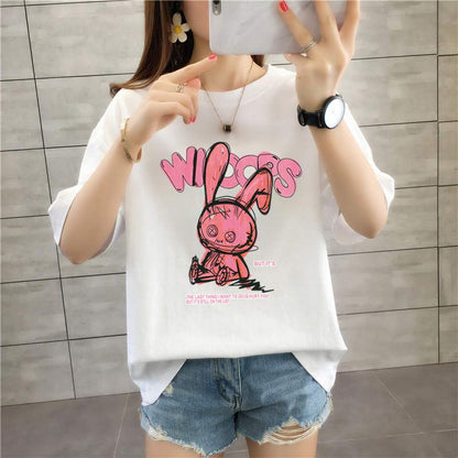 White round neck women’s t-shirt with pink cartoon print paired with denim shorts